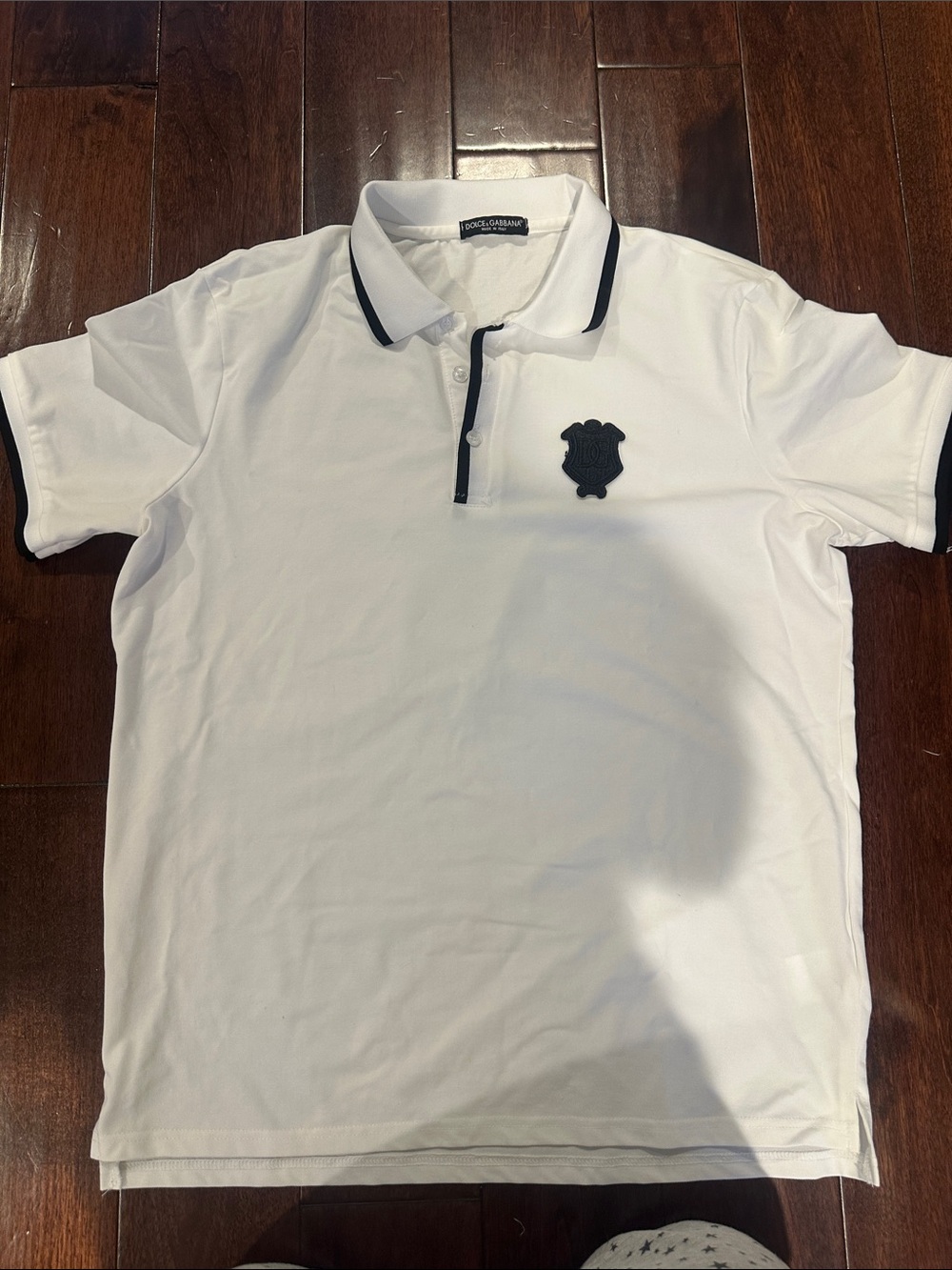 White Polo with Black Trim and Crest